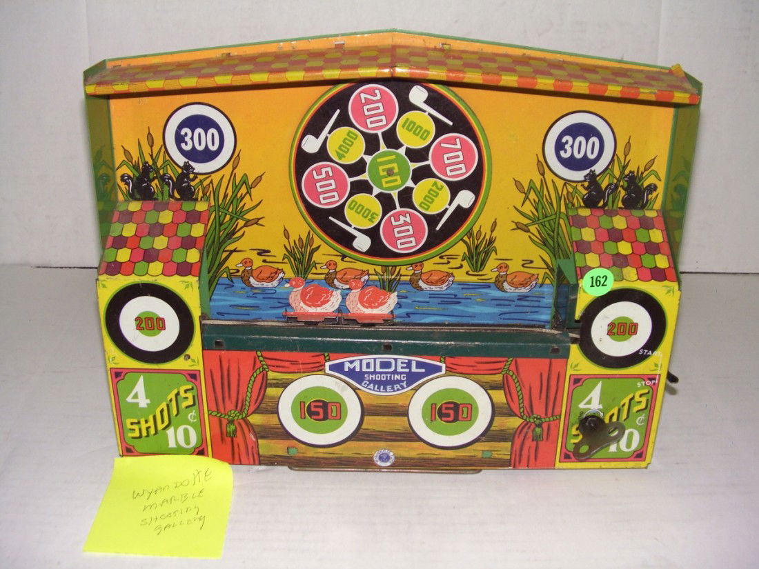 antique toy wind up tin Wyandotte shooting toy / g: antique toy wind up tin Wyandotte shooting toy / game