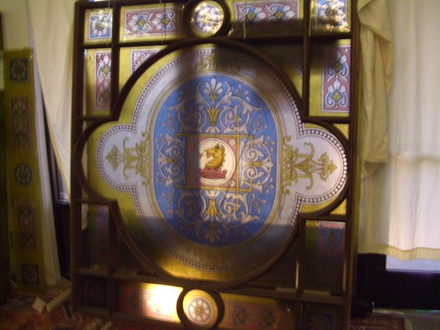 2 piece unbelievable architectural ceiling hangin: crest design, these would be found in a bank - proff building - court house ect. each frame comes with 3 piece glass (1) large center glass (2) side panels offered as a set. extremely heavy very large