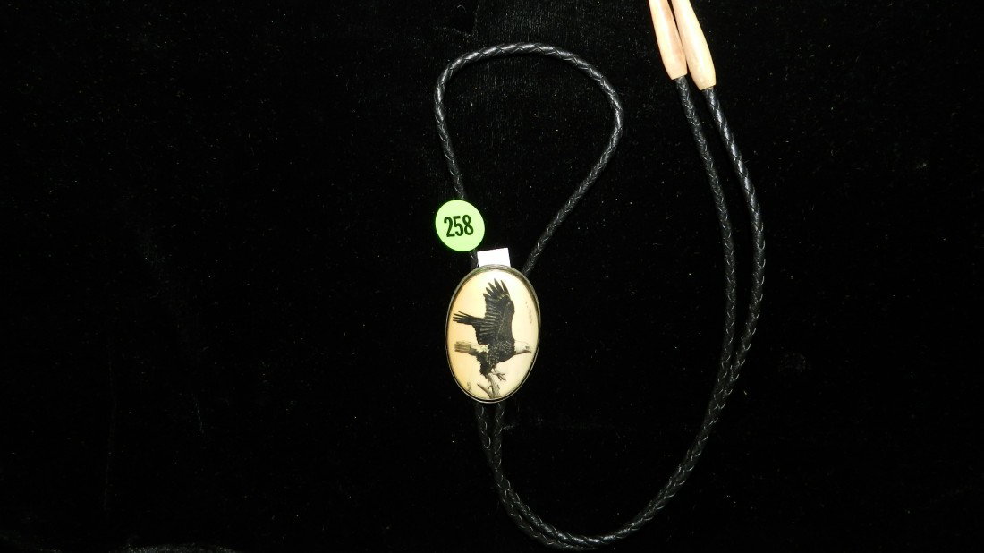 Ivory scrimshawed bolo with Eagle in flight (signe: Ivory scrimshawed bolo with Eagle in flight (signed)