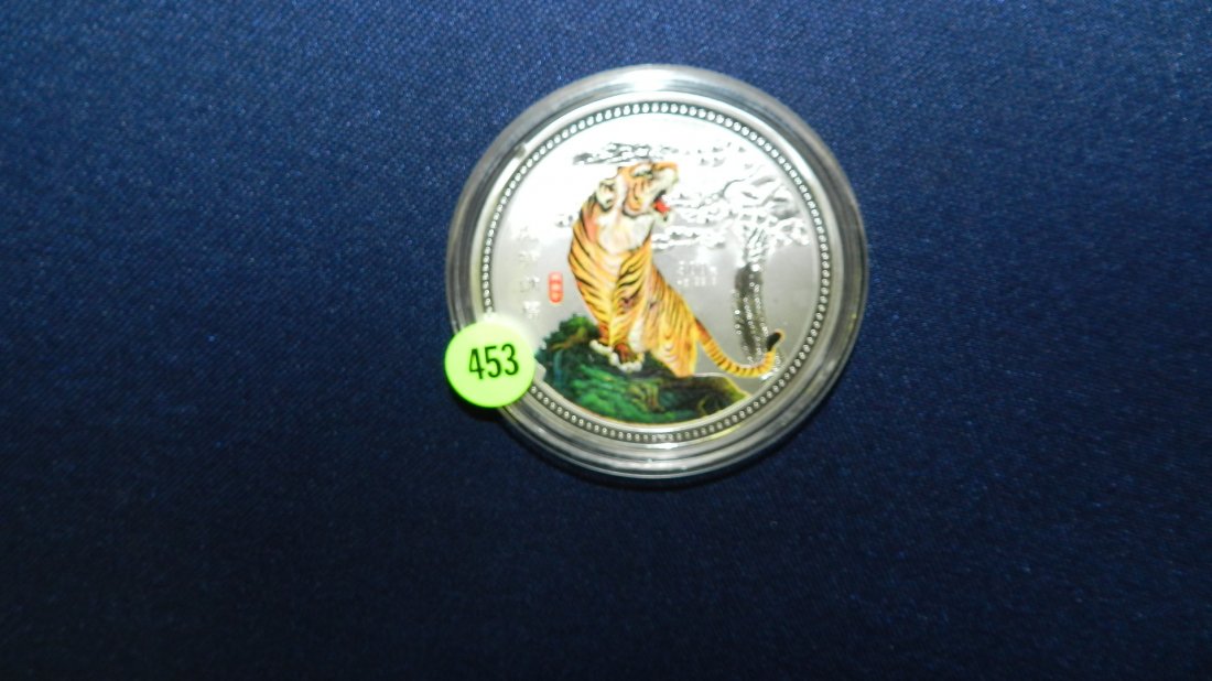 large 2010 Korean silver (metal not sterling) coin: large 2010 Korean silver (metal not sterling) coin with painted tiger, neat collector's item