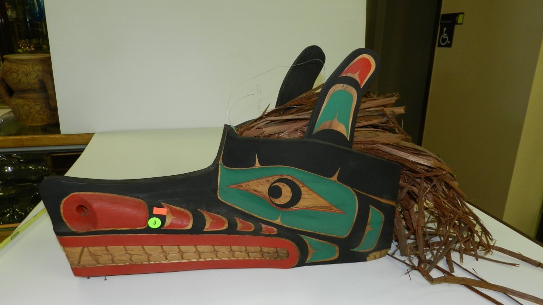 outstanding Native American hand carved Wolf mask by To: outstanding Native American hand carved Wolf mask by Tony Gulbrandsen (signed) hand painted 15x22, cond VG, Tony Gulbrandsen was born of Tsimshian heritage on the Northern British Columbian coast. Now