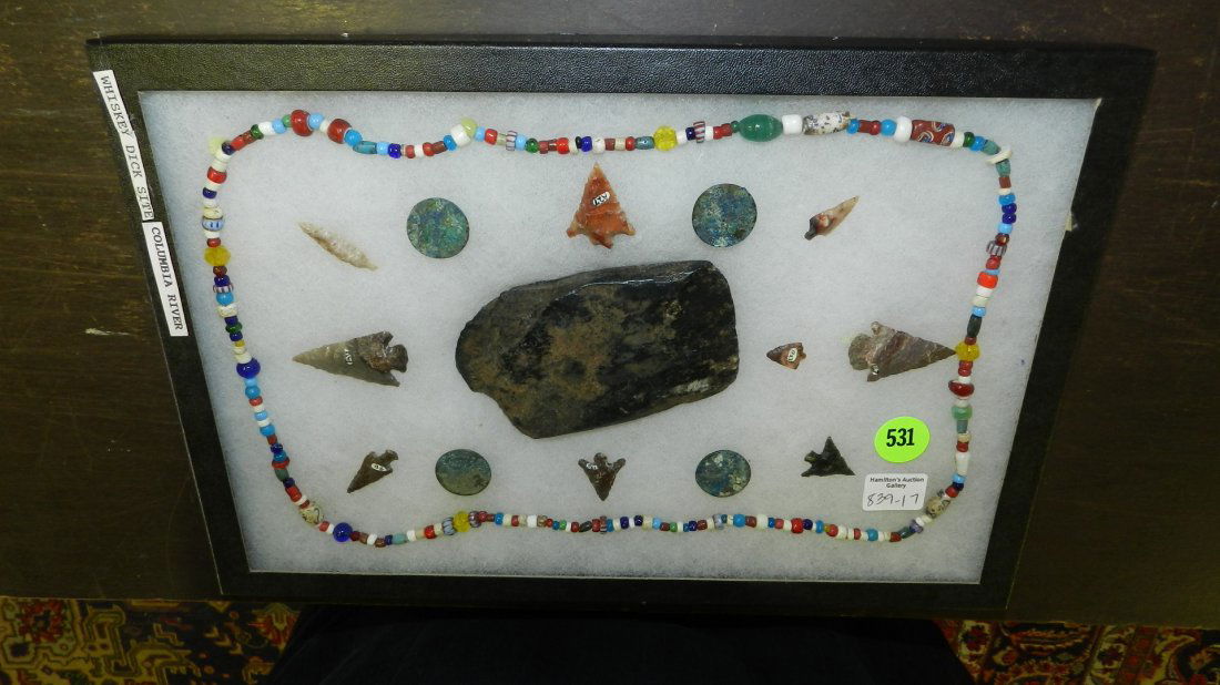 Collection of excavated Native American artifacts from: Collection of excavated Native American artifacts from the Whiskey Dick site, Columbia river, including arrow heads, coins, necklace and scraper.