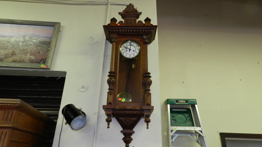 Antique tall case Royal Vienna style wall clock, as: Antique tall case Royal Vienna style wall clock, as seen, missing one pillar on side. COND Fair. 43"