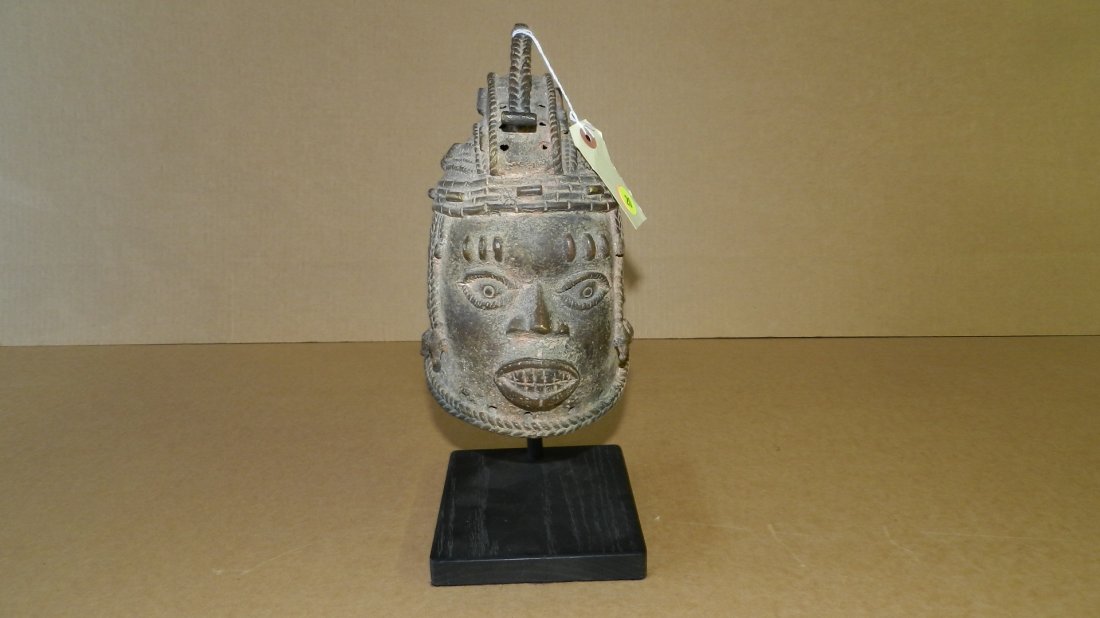 5741) African Benin bronze portrait head helmet mask: 5741) African Benin bronze portrait head helmet mask display on stand, mask is 8 3/4 with stand 12 1/2 tall