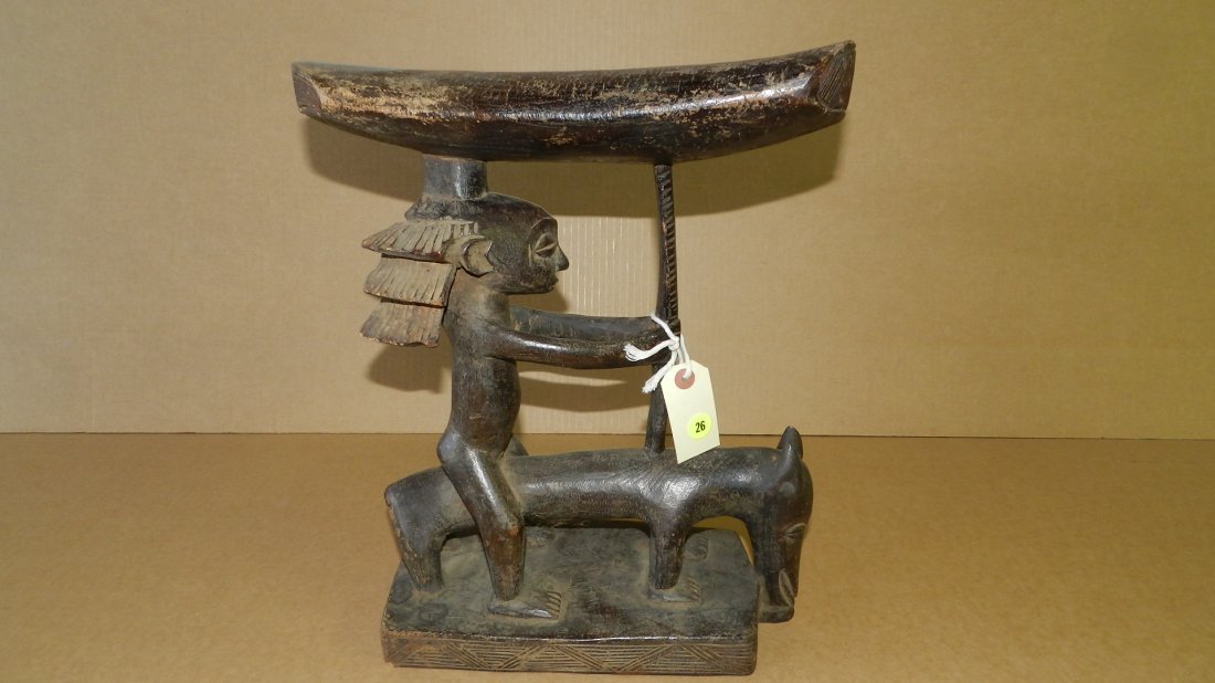 10064) Unique African hand carved Caryatid, horseman: 10064) Unique African hand carved Caryatid, horseman supporting seat. Dark stain / patina, COND G, shows wear from age, 16 x 5 1/2 x 13 1/2