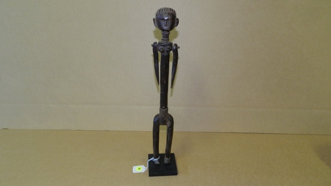 4125) East African carved standing female figure with: 4125) East African carved standing female figure with articulated arms, COND G, 19 1/8" W/stand