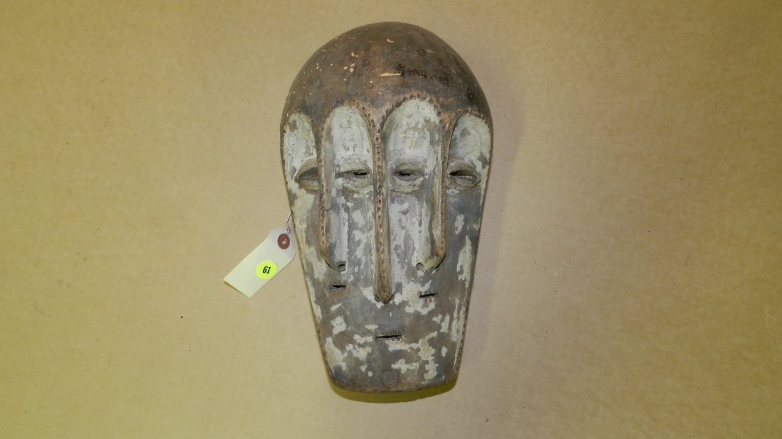 3917) African carved Mask w/3 noses and 5 eyes w/white: 3917) African carved Mask w/3 noses and 5 eyes w/white pigment, COND G, 11 x 6 1/2 x 5 1/4
