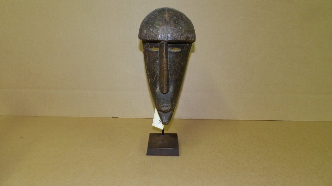 5876) unique African carved elongated face mask, on: 5876) unique African carved elongated face mask, on stand mask is 15 x 5 1/2