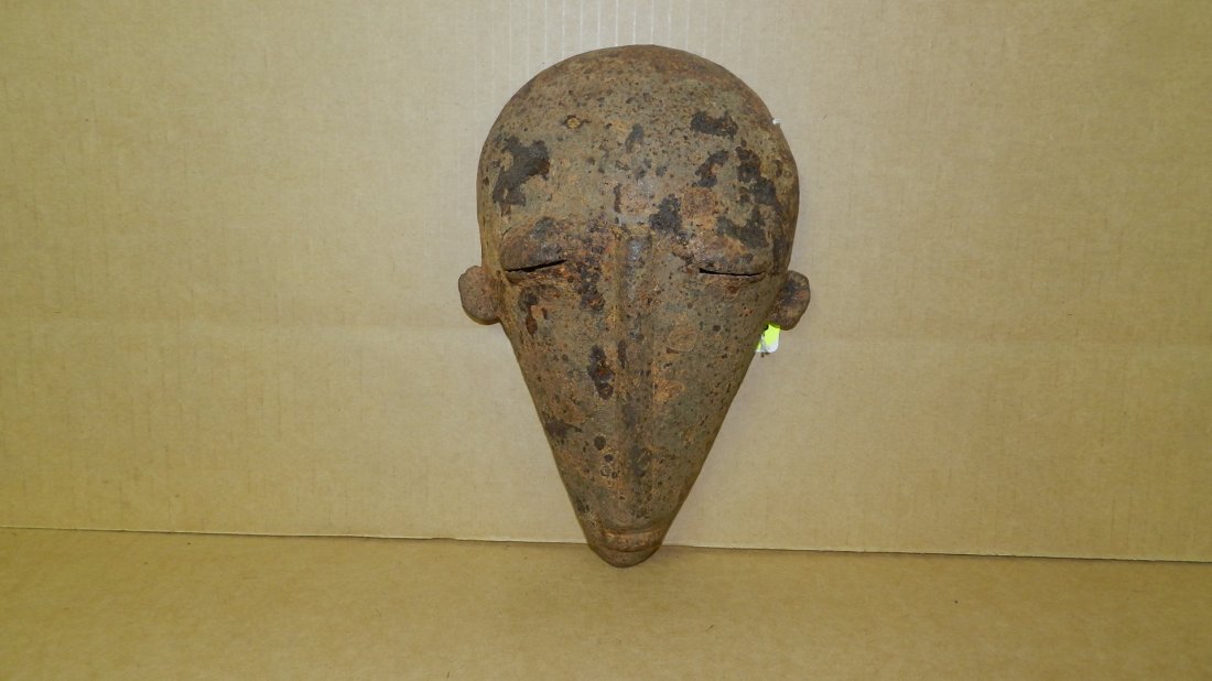 1417) African made Bambara metal mask, as seen, on: 1417) African made Bambara metal mask, as seen, on stand mask is 9 x 6