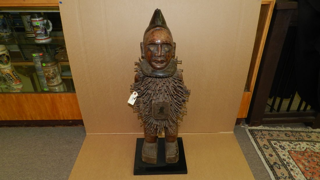 1041) African carved Nail fetish figure, from DR Congo,: 1041) African carved Nail fetish figure, from DR Congo, COND G, 38" w/stand.