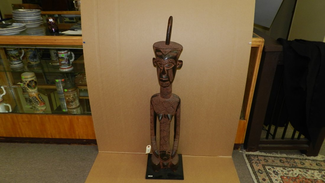 1045) African carved Dengese style figure, right breast: 1045) African carved Dengese style figure, right breast repaired, on base. From DR Congo. COND G, 45" w/stand