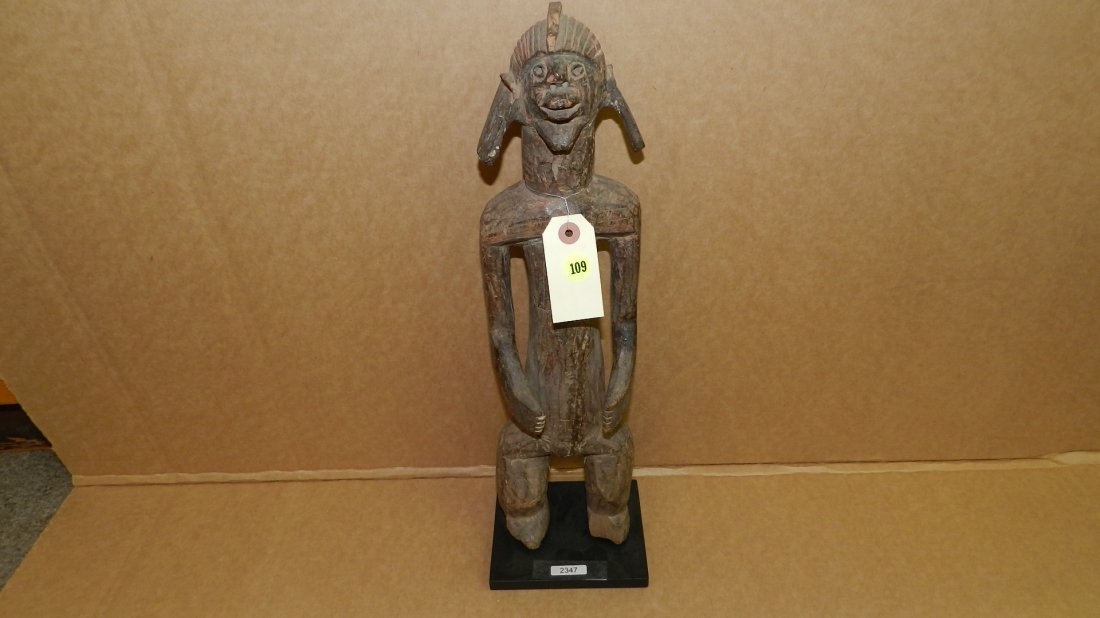 2347) Unique African carved standing figure with: 2347) Unique African carved standing figure with elongated ear lobes, COND Fair, 19"