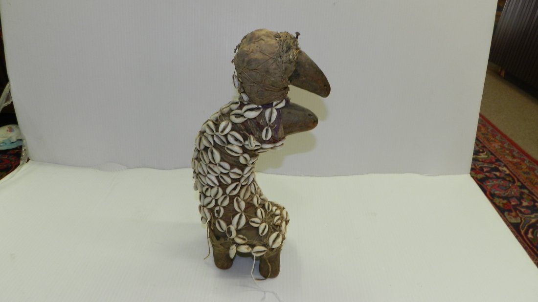 1302) Unusual African carved Bambara figure - animal: 1302) Unusual African carved Bambara figure - animal wrapped in burlap and cowries (sea snail shells), COND G, 15"