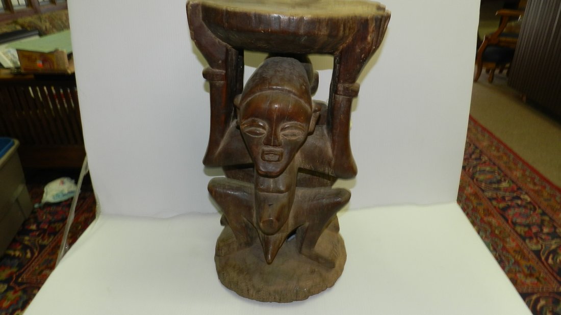 614) African hand carved large Janus stool with both: 614) African hand carved large Janus stool with both male and femlae carved figures,22x14