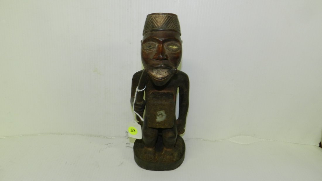 1602) Amazing African hand carved Sitting Kongo figure: 1602) Amazing African hand carved Sitting Kongo figure with mirror covered fetish abdominal cavity (Cracked base, erosion on top of hat, minor crack by right eye and some erosion on face) 12 1/4