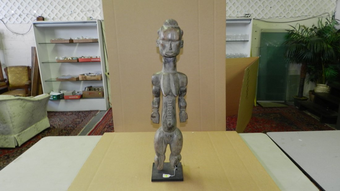 1471) African carved Female standing figure w/ eroded f: 1471) African carved Female standing figure w/ eroded feet. From Cameroon. 34" /4