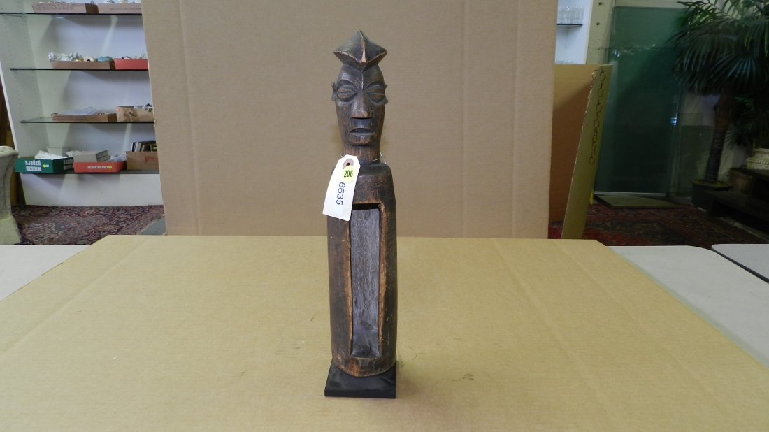 6635) African carved Yaka slit drum, on stand. From DR: 6635) African carved Yaka slit drum, on stand. From DR Congo. 17 1/4"