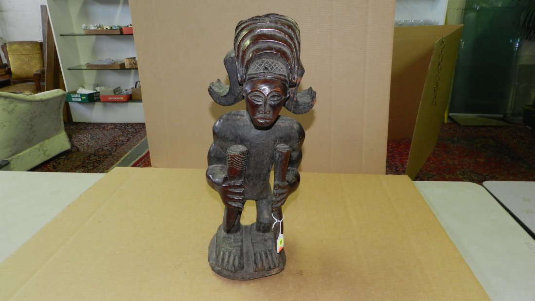 821) African carved Standing figure w/ home and staff,: 821) African carved Standing figure w/ home and staff, carved coiffure. From DR Congo. 22"