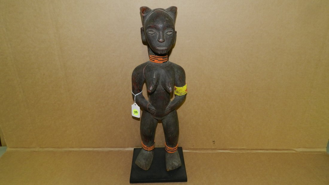 4127) African carved Eastern Africa standing female fig: 4127) African carved Eastern Africa standing female figure, from Tanzania. 19"