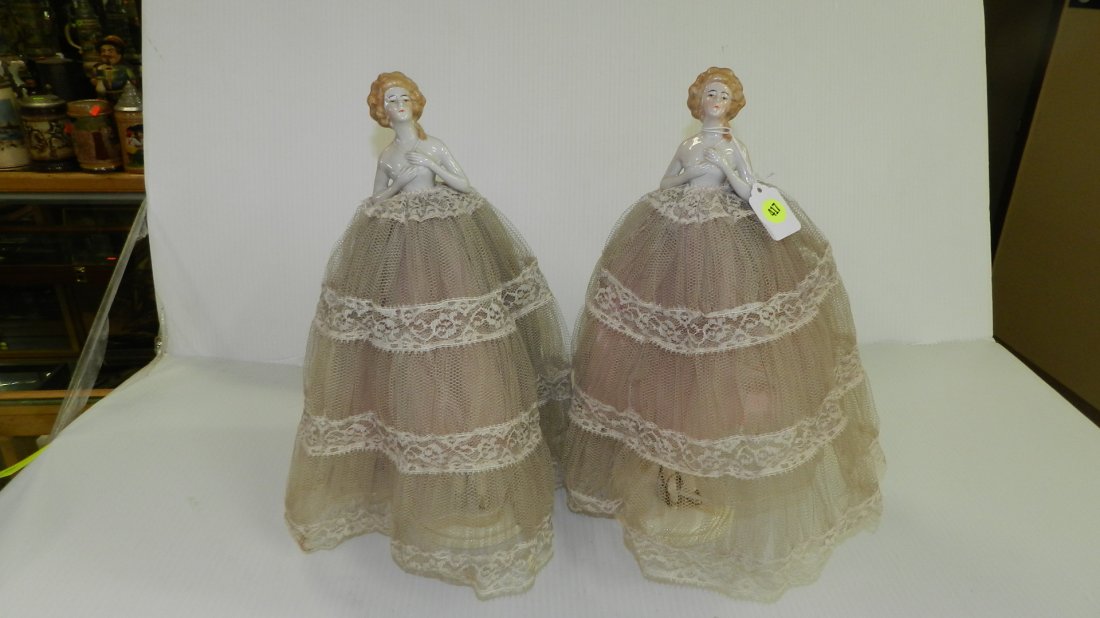 72) Pair of Bavarian-marked porcelain antique lamps.: 72) Pair of Bavarian-marked porcelain antique lamps. Detailed half doll with porcelain-legged base.