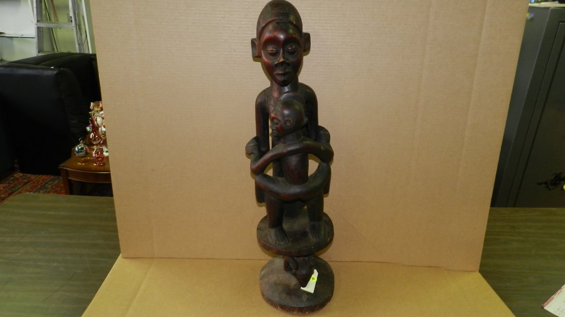 1208) Central African carved Maternity figure on: 1208) Central African carved Maternity figure on caryatid stool. 30"