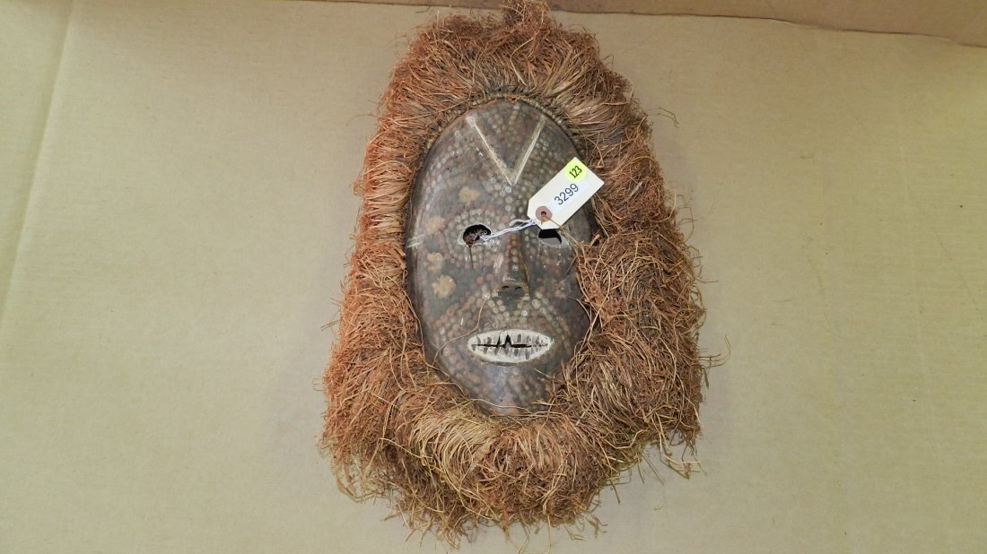 3299) African carved mask with dots throughout. Kumu or: 3299) African carved mask with dots throughout. Kumu or related group. from DR Congo. 17 x 12 w/Raffia
