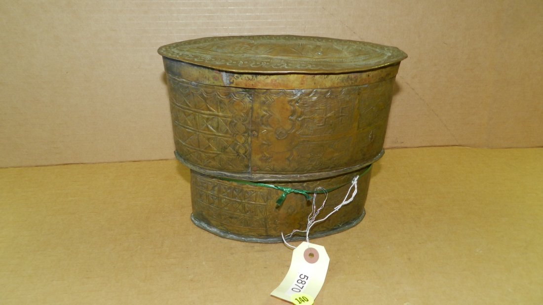 5870) African AKAN BRASS LIDDED BOX. Embossed with: 5870) African AKAN BRASS LIDDED BOX. Embossed with symbolic Motifs in two parts, the upper half with lid, lower half with slot on the bottom. In good condition, appropriate for age, origin, and medium