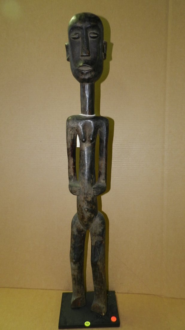 2428) African carved Tall slender female figure 39": 2428) African carved Tall slender female figure 39" with stand from East Africa
