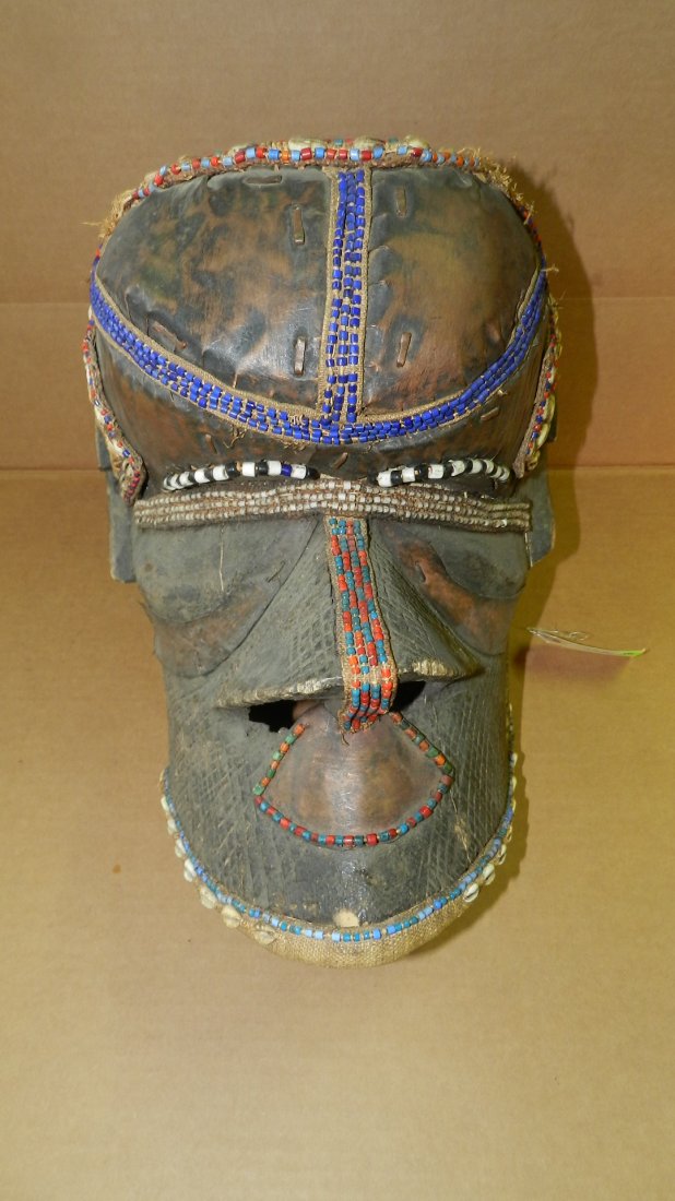 3224) African carved Kuba mask, bwoom. Blackened wood: 3224) African carved Kuba mask, bwoom. Blackened wood with attached thin copper sheets, cloth with b