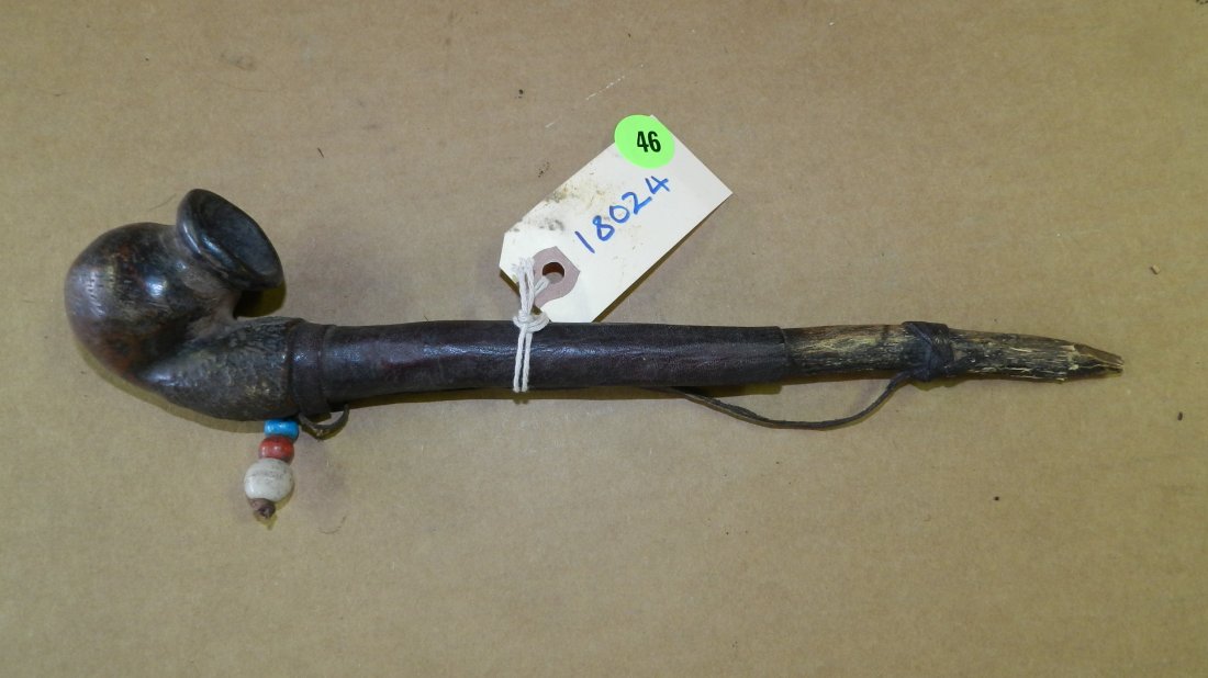 18024) African carved pipe with leather covered wooden: 18024) African carved pipe with leather covered wooden stem. (Stem not drilled) 11"