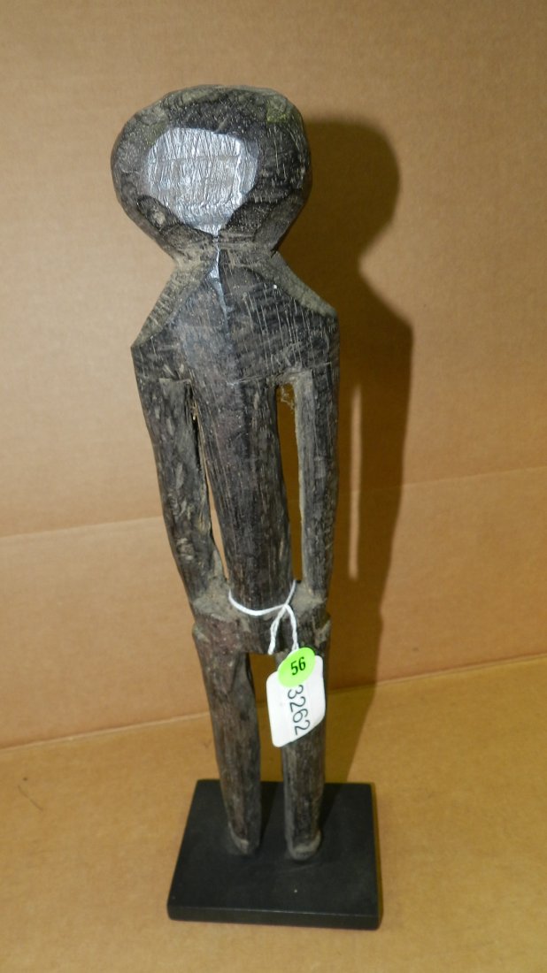 3262) African carved stylized asexual figure, from: 3262) African carved stylized asexual figure, from Togo. 14"