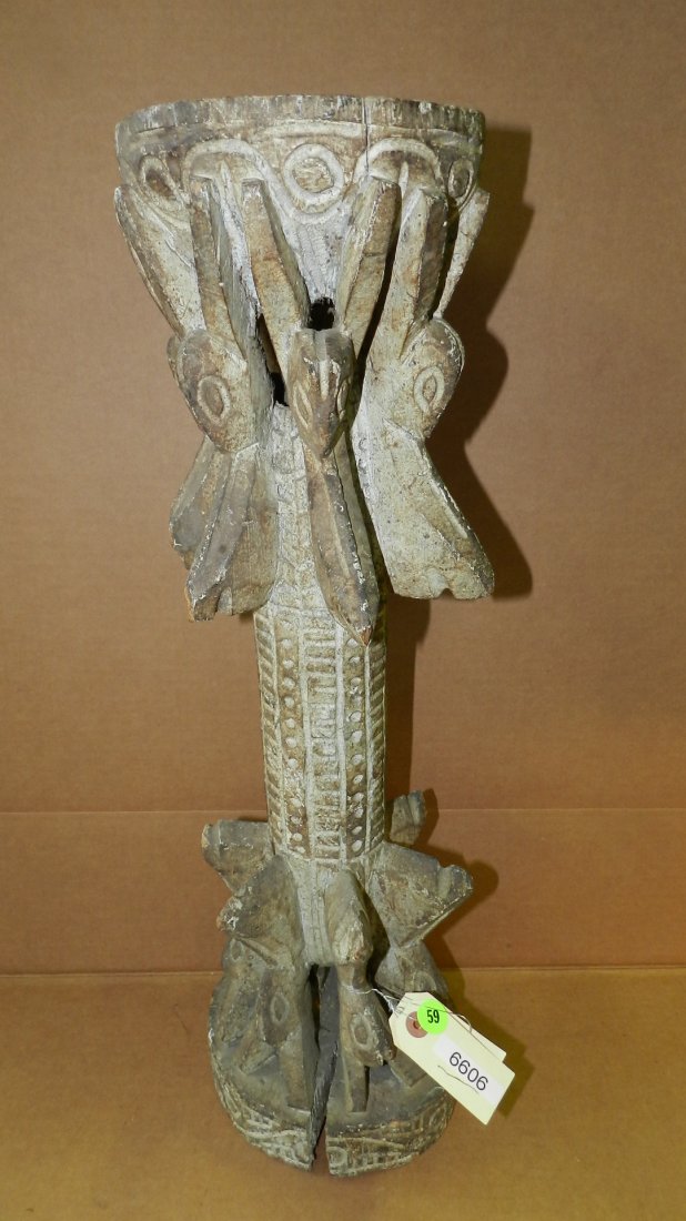 6606) West African carved stand with concave top, some: 6606) West African carved stand with concave top, some erosion to pedestal. 23 1/2 x 6 1/2