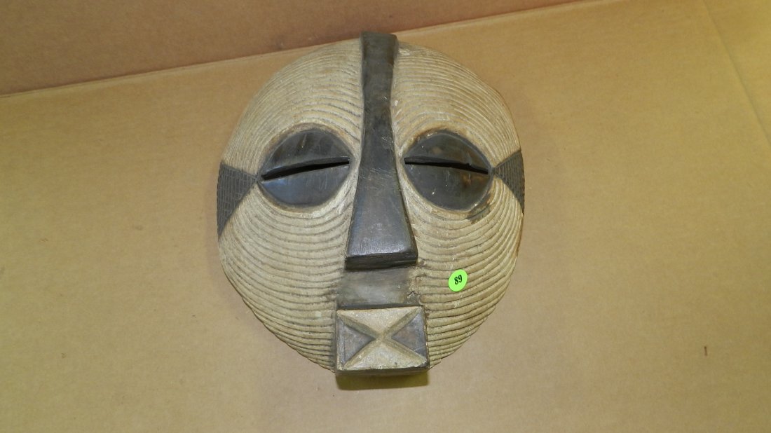African hand carved and painted mask. 13 x 10 1/2 x 5: African hand carved and painted mask. 13 x 10 1/2 x 5