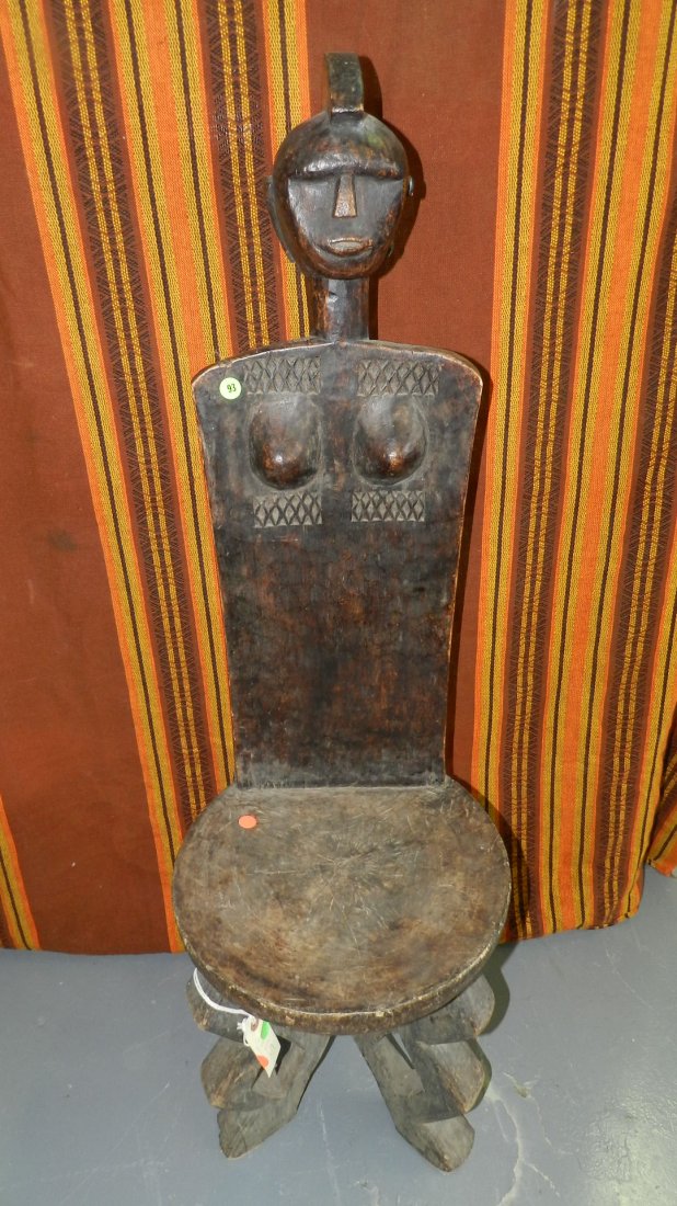 1115) African carved high backed chair from Tanzania.: 1115) African carved high backed chair from Tanzania. 42 1/2" Shipping Alert * this item is larger than what our shippers can handle, we can still offer to ship this item to you with our "In-house" sh