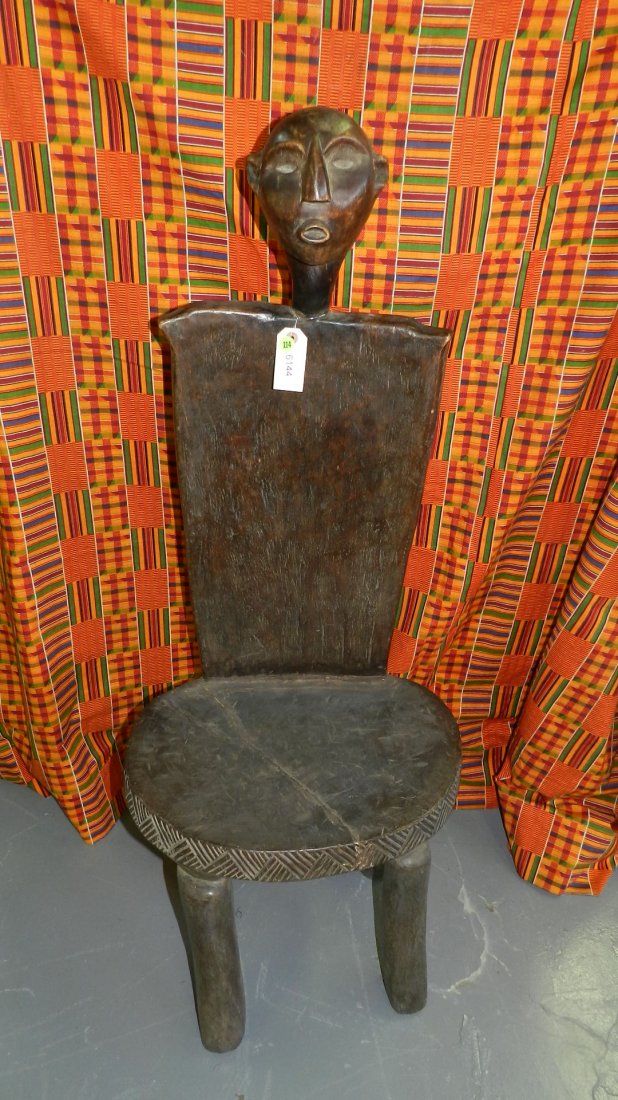 6144) Unique High backed chair - East African with: 6144) Unique High backed chair - East African with carved head, Tanzania, 48" tall Shipping Alert * this item is larger than what our shippers can handle, we can still offer to ship this item to you w