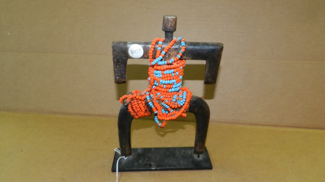 2008) African carved child's Namji doll with beads.: 2008) African carved child's Namji doll with beads. Repair to arm. On Stand. 10 x 5 3/4