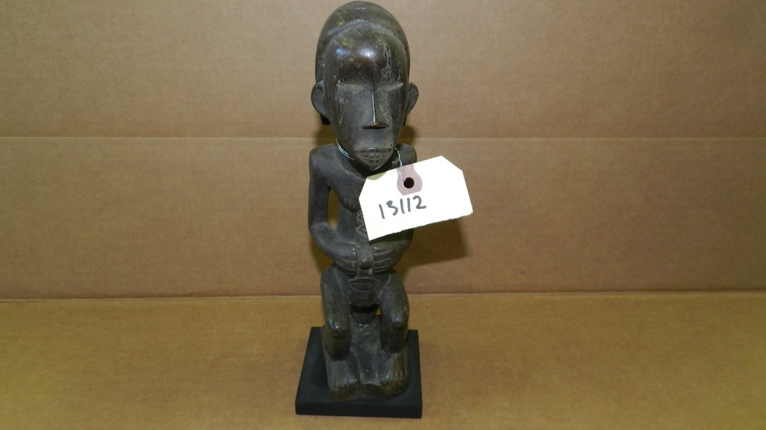 13112) African carved Seated female on head or mask. On: 13112) African carved Seated female on head or mask. On Stand. (Fang) 10 1/4