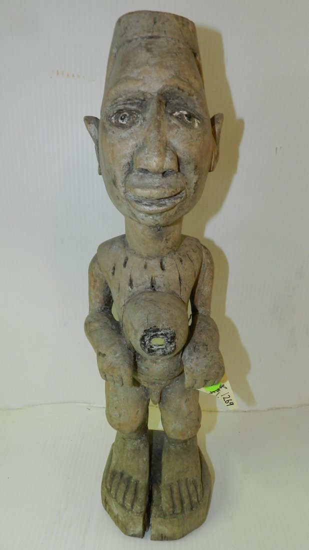 1269) African carved Standing male figure on pedestal.: 1269) African carved Standing male figure on pedestal. Crack on the integral base. Kongo, DR Congo 18 1/4