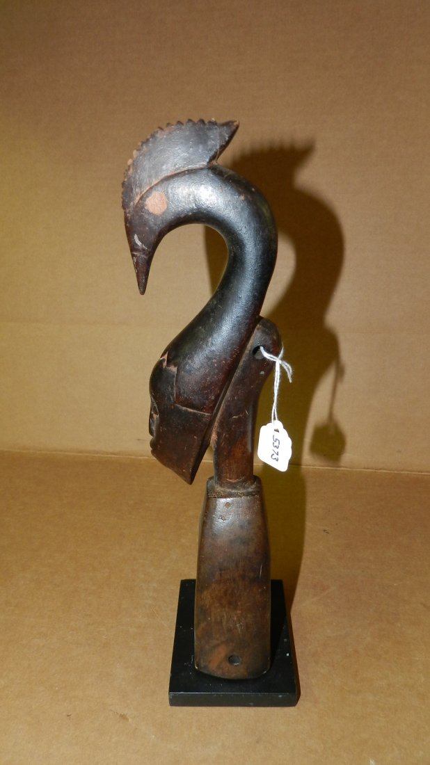 5373) African carved Guro blackened heddle pulley frame: 5373) African carved Guro blackened heddle pulley frame with bird, from Ivory Coast. 13" w/stand
