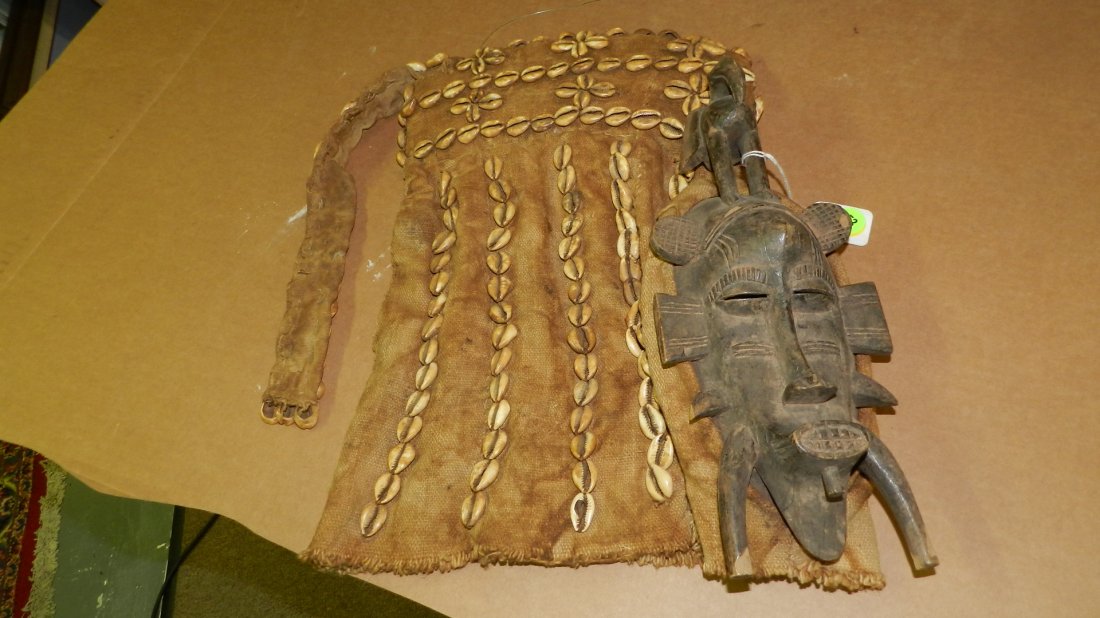 6250) African carved Senufo Kpelie Mask, with large: 6250) African carved Senufo Kpelie Mask, with large head gear - burlap/cowries. From Ivory Coast. 14 x 20