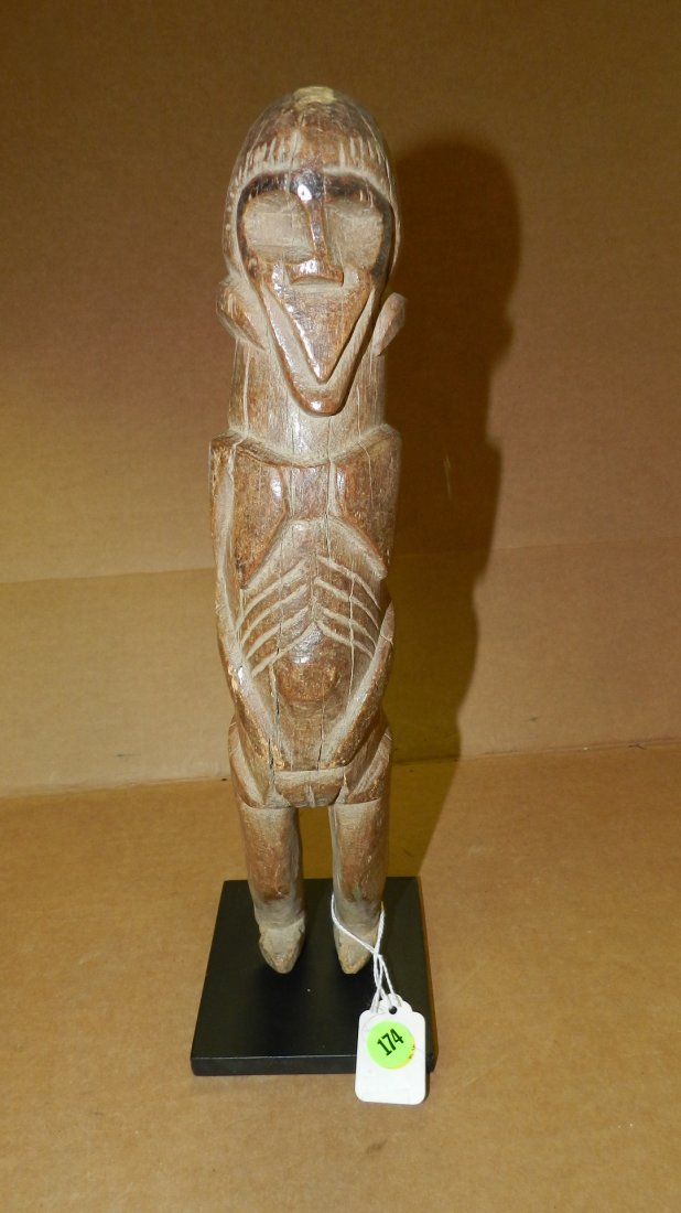 9281) African carved Standing female figure with some: 9281) African carved Standing female figure with some erosion to the feet and multiple cracks throughout on stand 15" West Africa