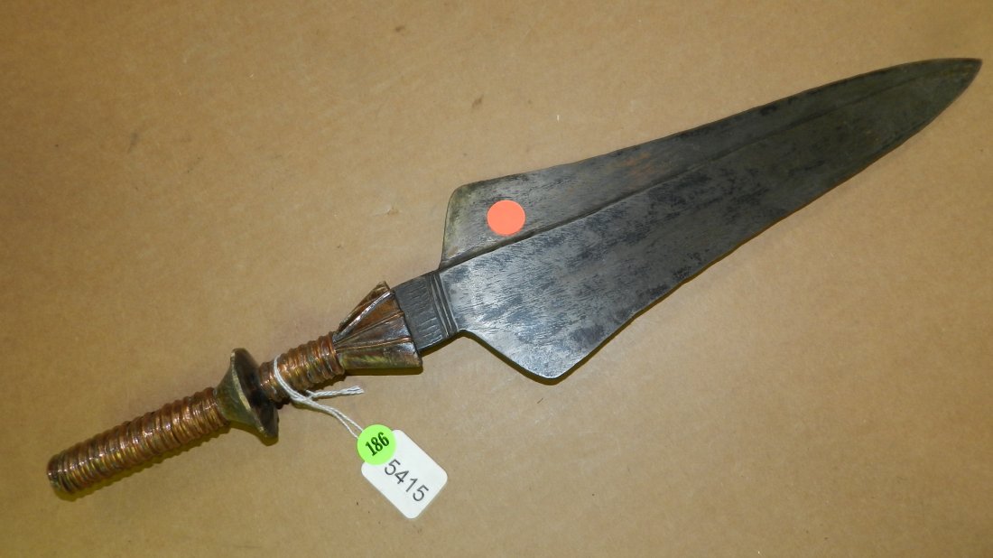 5415) African Knife w/ copper inlaid and wrapped: 5415) African Knife w/ copper inlaid and wrapped handle. Blade tapered 12.75" long and 4.25" wide. Ridge line in blade.
