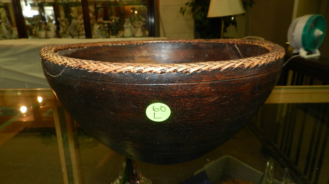 African hand carved wooden: African hand carved woodenbowl, has crack. 11"