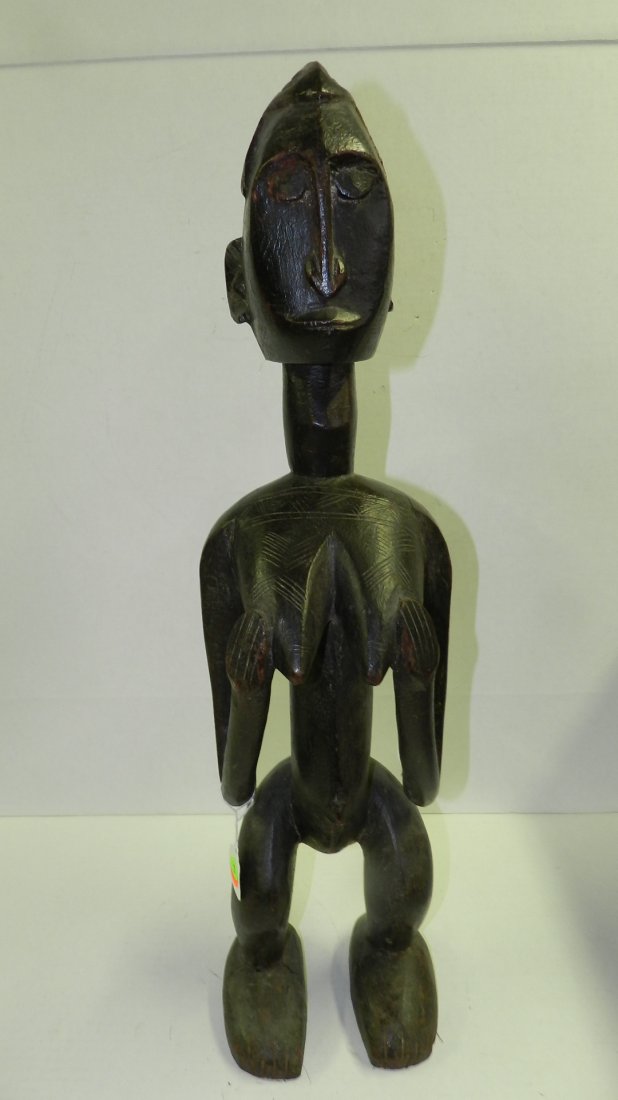 6941) West African carved standing female figure. 28 1/: 6941) West African carved standing female figure. 28 1/2"