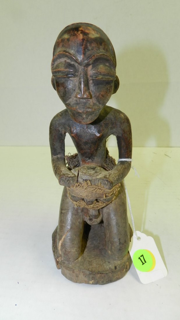 9111) African carved kneeling male figure. 8 1/2": 9111) African carved kneeling male figure. 8 1/2"