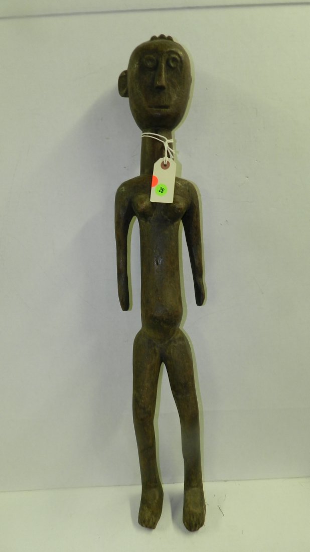 6016) East African carved female standing figure, from: 6016) East African carved female standing figure, from Tanzania. 32"