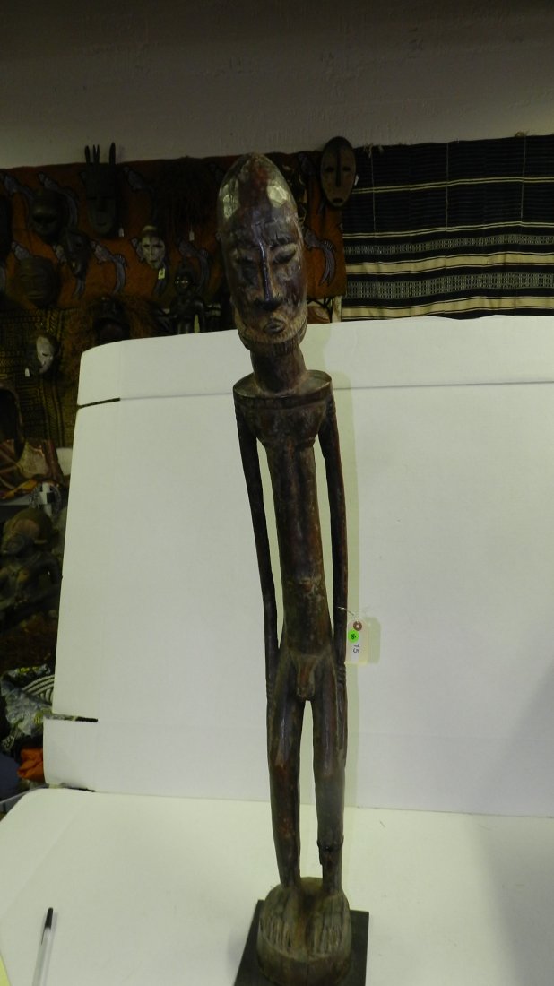15) African carved Dogon, Nongom style figure. From Mal: 15) African carved Dogon, Nongom style figure. From Mali, has loss / crack. SSR. 43"