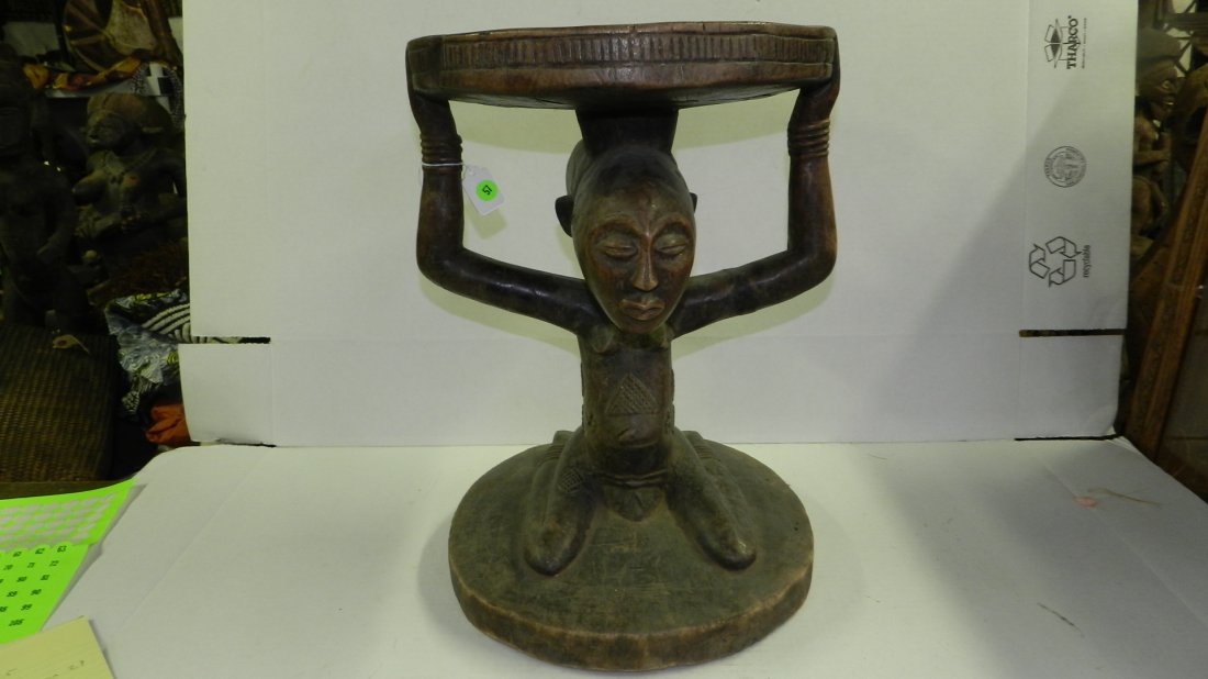 1322) African carved stool with kneeling figure 20 x 14: 1322) African carved stool with kneeling figure. 20 x 14