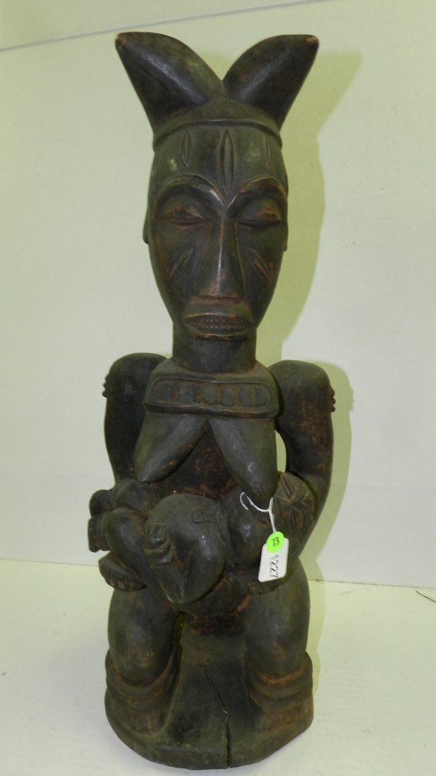 1227) Hand carved African seated maternity figure on ba: 1227) Hand carved African seated maternity figure on base. 25"