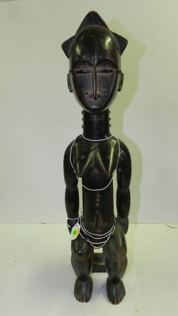 5727) African carved figure, female sitting on stool. F: 5727) African carved figure, female sitting on stool. From Ivory Coast. 24"
